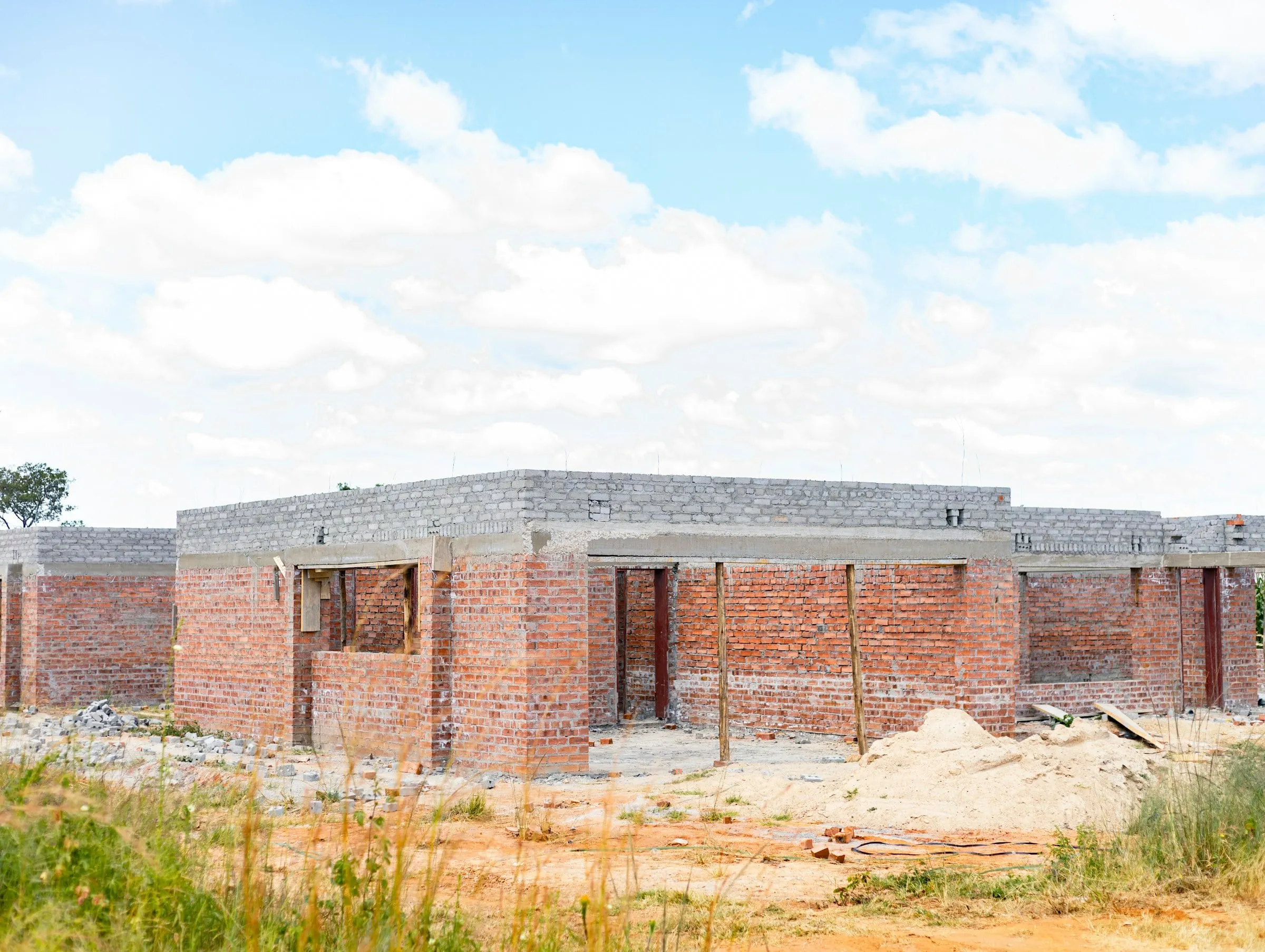 Brick walls of a home under construction, representational image